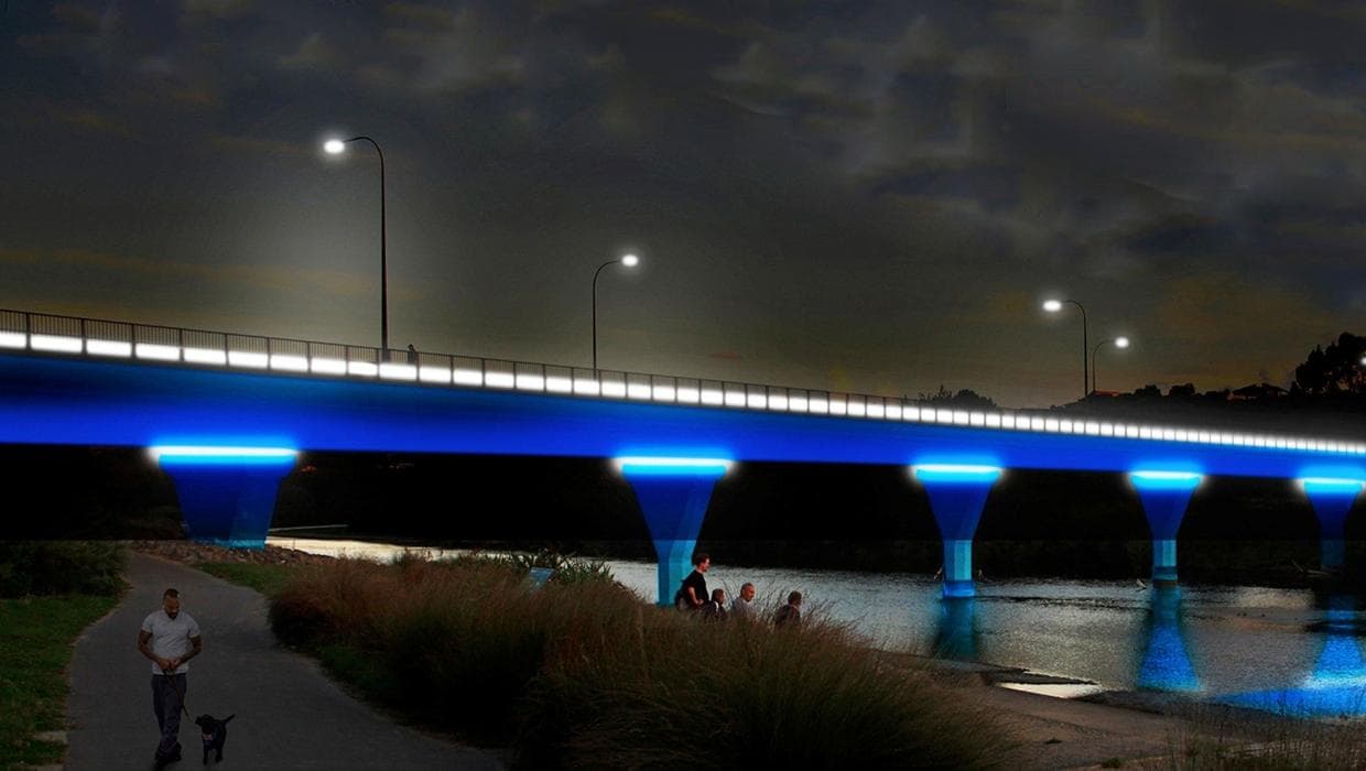 Riverside pathway and bridge lighting context
